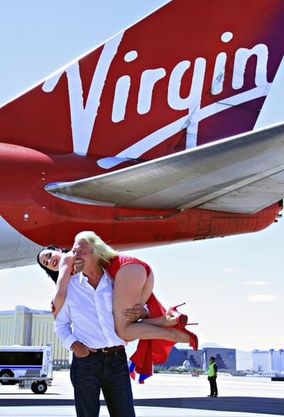 Richard Branson, a whiner running down the road with a billion dollar cheque